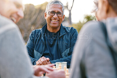 Buy stock photo Happy, chess or couple of friends in nature playing a board game, bonding or talking about a funny story. Park, support or healthy senior people laughing at a joke and enjoying quality relaxing time 