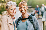 Elderly women, smile and hiking with fitness outdoor, trekking with friends and retirement, vitality and active life. Portrait, exercise and cardio, happy hiker in park, travel and nature adventure.