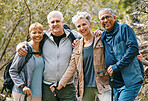 Senior hiking group, portrait and smile in nature, forest and happy for adventure together in summer. Friends, woods and happiness by trees, outdoor and sunshine for exercise, wellness and retirement