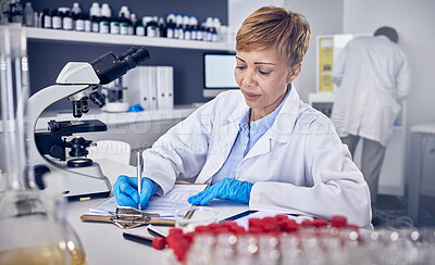 Buy stock photo Senior black woman, research or scientist writing a science report in a laboratory for medical data analysis. Healthcare, focus or doctor working on chemistry paperwork, documents or development 