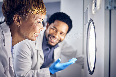 Buy stock photo Science, man and woman in laboratory, research and test sample for cure, vaccine or conversation. Researchers, scientist or staff talking, data analysist and check experiment for innovation or expert