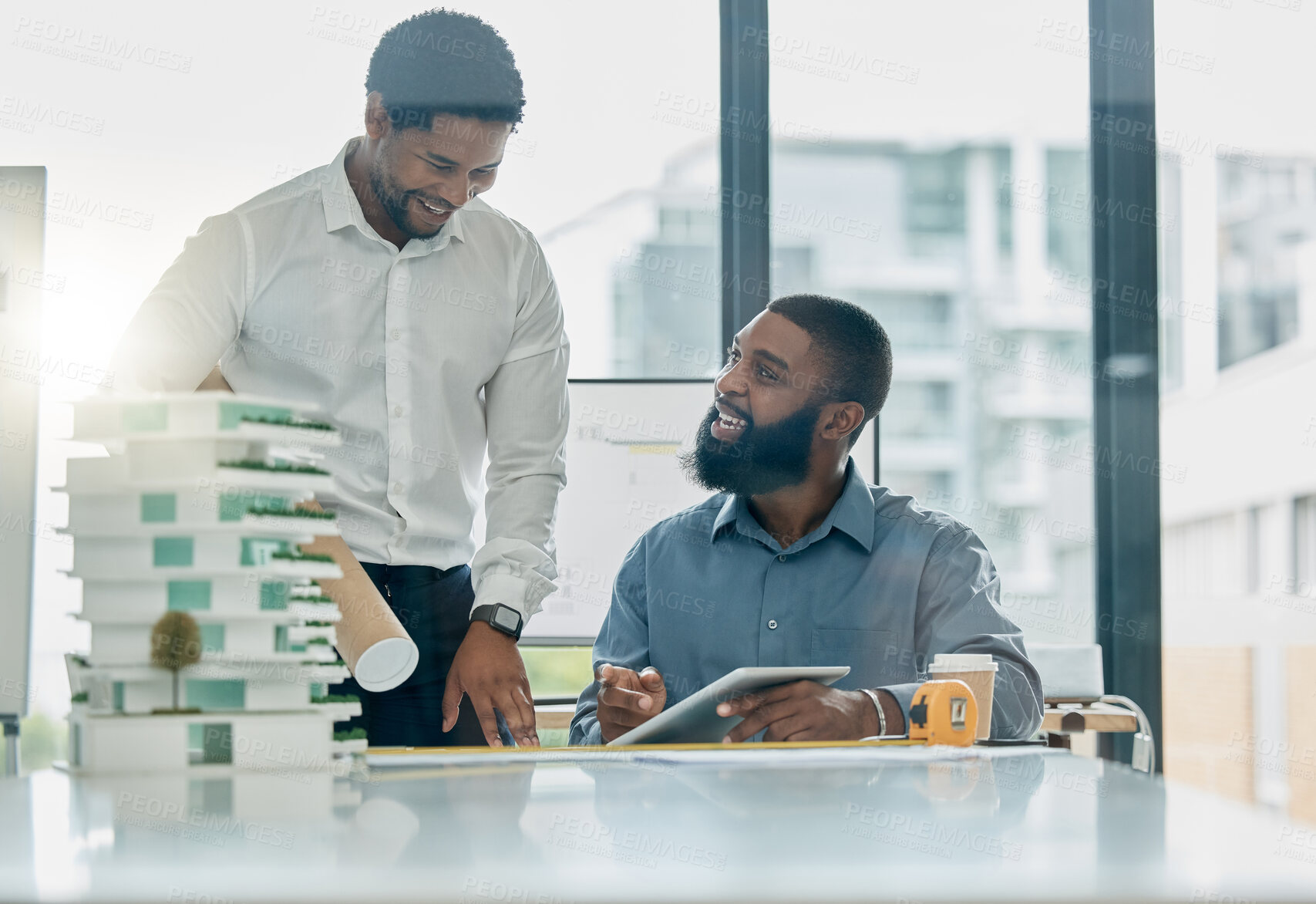 Buy stock photo Tablet, architecture and collaboration with a business black man architect team working in their office. Building, design or teamwork with a male employee and colleague at work on a development model