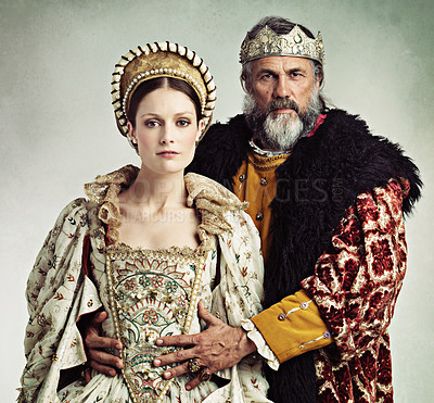 Buy stock photo Crown, queen and king in costume isolated on studio background for medieval, renaissance and England culture. Headshot portrait of royal couple with power, wealth and vintage fashion for power