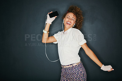 Buy stock photo Phone music, singing and dancing black woman listen to song, audio podcast or radio sound for fun energy. Studio singer mockup, dancer girl and dance student isolated on mock up chalkboard background