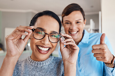 Buy stock photo Shot of an optometrist giving thumbs after after an eye exam with a patient