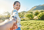 Woman, park portrait and pov for holding hands, romance and love on nature adventure in sunshine. Girl, summer and outdoor in countryside with smile, happy and bonding by trees, grass and mountain
