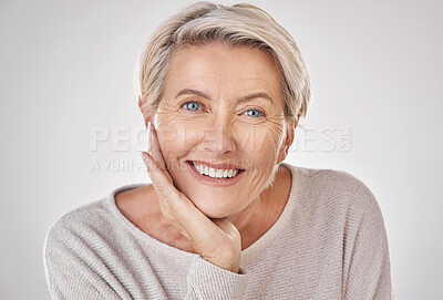 Buy stock photo Face of beauty, mature woman with care and wellness in studio. Smile with natural makeup, anti aging dermatology and skincare or health. Portrait of a happy and relaxed lady with a positive mindset