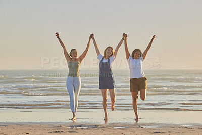 Buy stock photo Holding hands, friends and women on beach, jump together and bonding or loving outdoor on summer vacation. Travel, young females or ladies enjoy seaside holiday, for girls trip and connect on break.