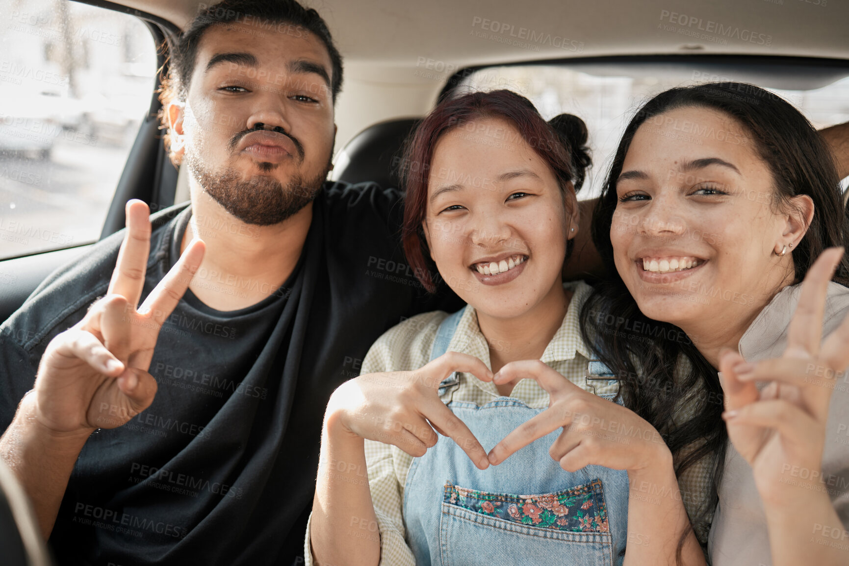 Buy stock photo Friends, road trip and hand gesture with a man and woman group making peace and heart shape sign in a car. Diversity, travel and transportation with a male and female friend bonding in a vehicle