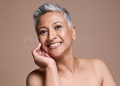 Buy stock photo Face, skin and beauty with woman in antiaging skincare portrait, smile and healthy glow with cosmetics and dermatology against brown studio background. Facial and treatment with makeup mockup.