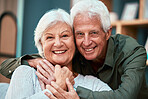 Portrait, senior couple and hug in living room, family home and relaxing in lounge for love, care and retirement together in Australia. Happy, smile and elderly old man, woman and people in house