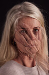 Gender violence, abuse and overlay with a senior woman in studio on a dark background for victim awareness. Portrait, face and hand with a mature female suffering from domestic violence or harassment