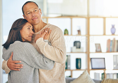 Buy stock photo Love, romance and married with a couple hugging while standing in their home together with mockup or flare. Affection, bonding and hug with a mature man and woman embracing in their domestic house