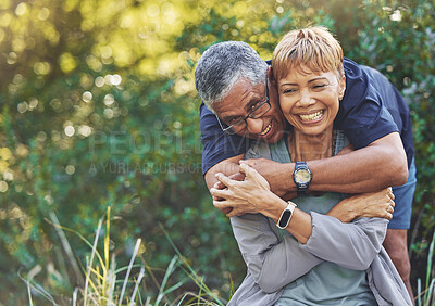 Buy stock photo Nature, love and man hugging his wife with care, happiness and affection while on an outdoor walk. Happy, romance and portrait of a senior couple in retirement embracing in the forest, woods or park.