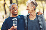Exercise, senior couple in park and water bottle for training, workout and smile. Mature man, elderly woman and hydration for practice, cardio and energy for wellness, health and fitness in nature.