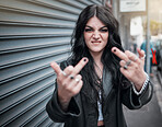 Face portrait, middle finger and woman in city with rude gesture or insult. Punk fashion, goth and female in street with anger, aggressive and bad hands sign, symbol or emoji for conflict expression