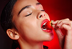 Face, eating and woman with red strawberry for fruit detox, health wellness goals or nutritionist diet. Lipstick makeup, erotic. beauty and sexy model girl with food product, skincare and cosmetics