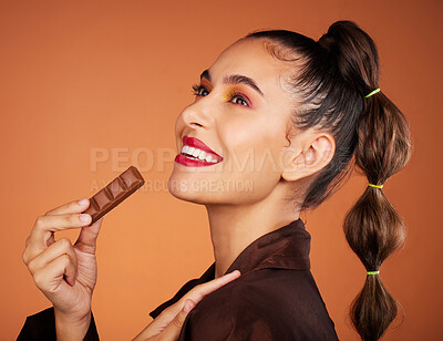 Buy stock photo Beauty, eating and profile woman with chocolate bar, junk food or dessert for sugar sweets, candy snack or cheat meal. Face makeup, skincare cosmetics and hungry hair model with brown cacao product