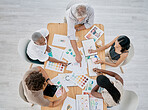 Team work, hands or creative business people in a meeting planning a logo, branding or marketing color on paper. Designers, top view or employees working with senior manager on strategy or kpi goals