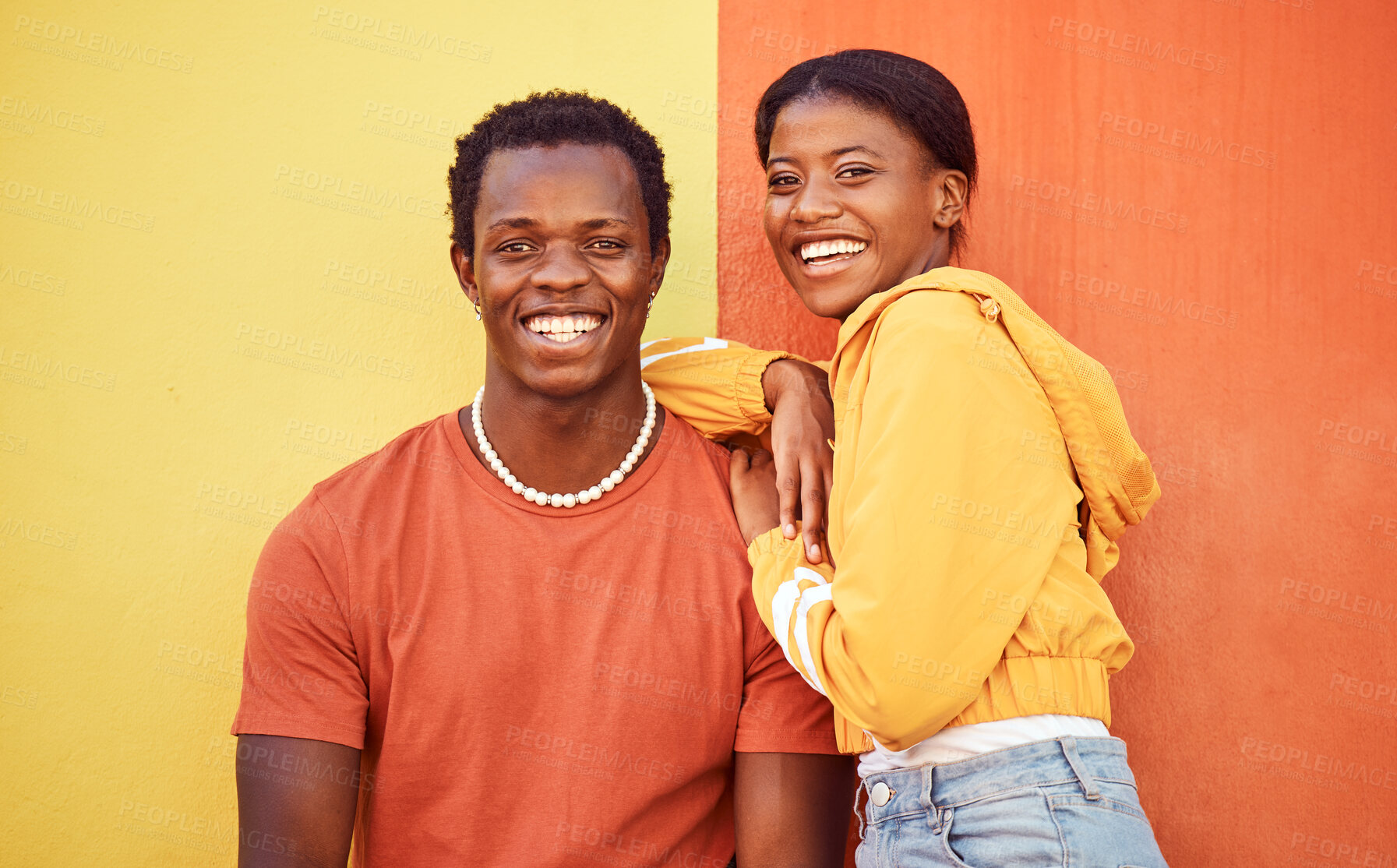 Buy stock photo Black couple, youth and fashion with gen z, hug and together with color and portrait against wall background. Black man, black woman and young with trendy streetwear, mockup and marketing in Nigeria.