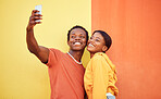 Gen z, young black couple happy in selfie with smartphone and influencer with post for social media against color wall background. Smile in picture, fashion mockup and tech with  man and woman youth