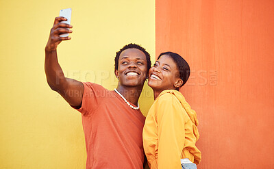 Buy stock photo Gen z, young black couple happy in selfie with smartphone and influencer with post for social media against color wall background. Smile in picture, fashion mockup and tech with  man and woman youth
