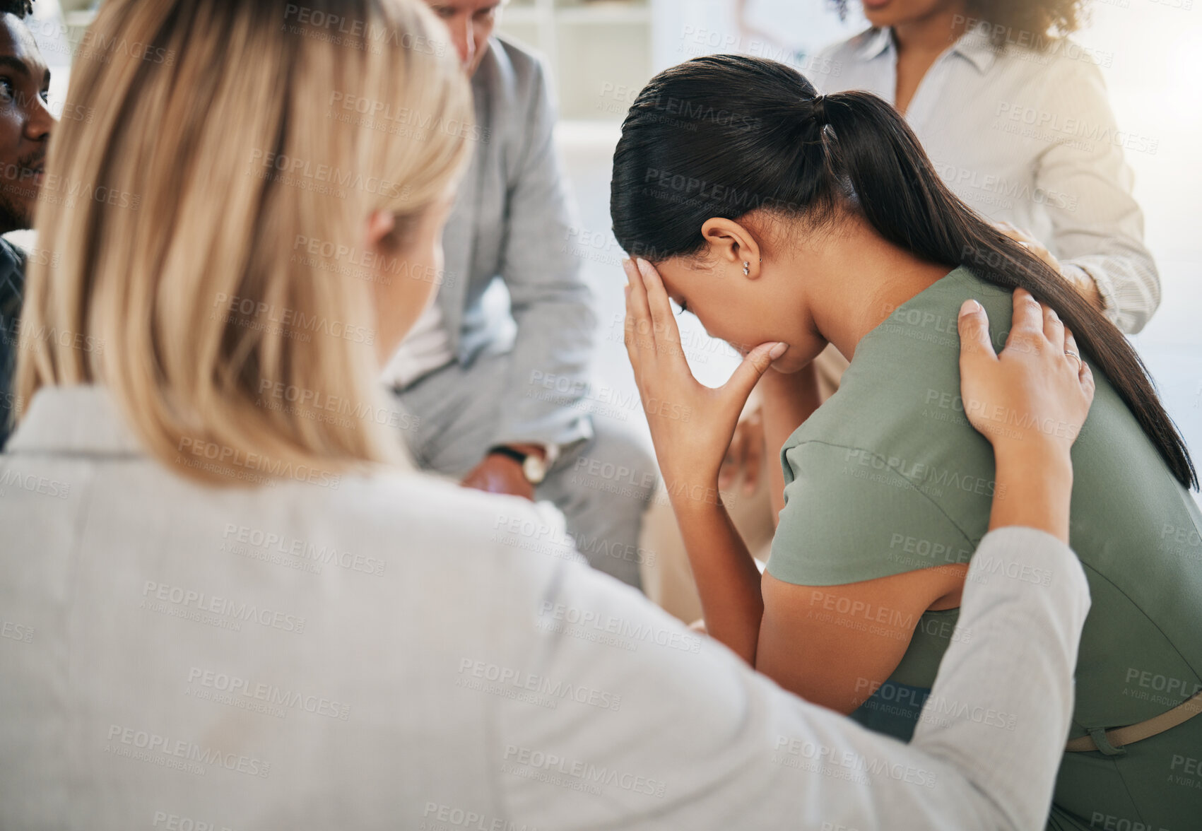 Buy stock photo Grief, loss and woman at community support group for mental health, counseling or help. Solidarity, trust and group of people in circle comforting, helping and supporting lady with bad news together.