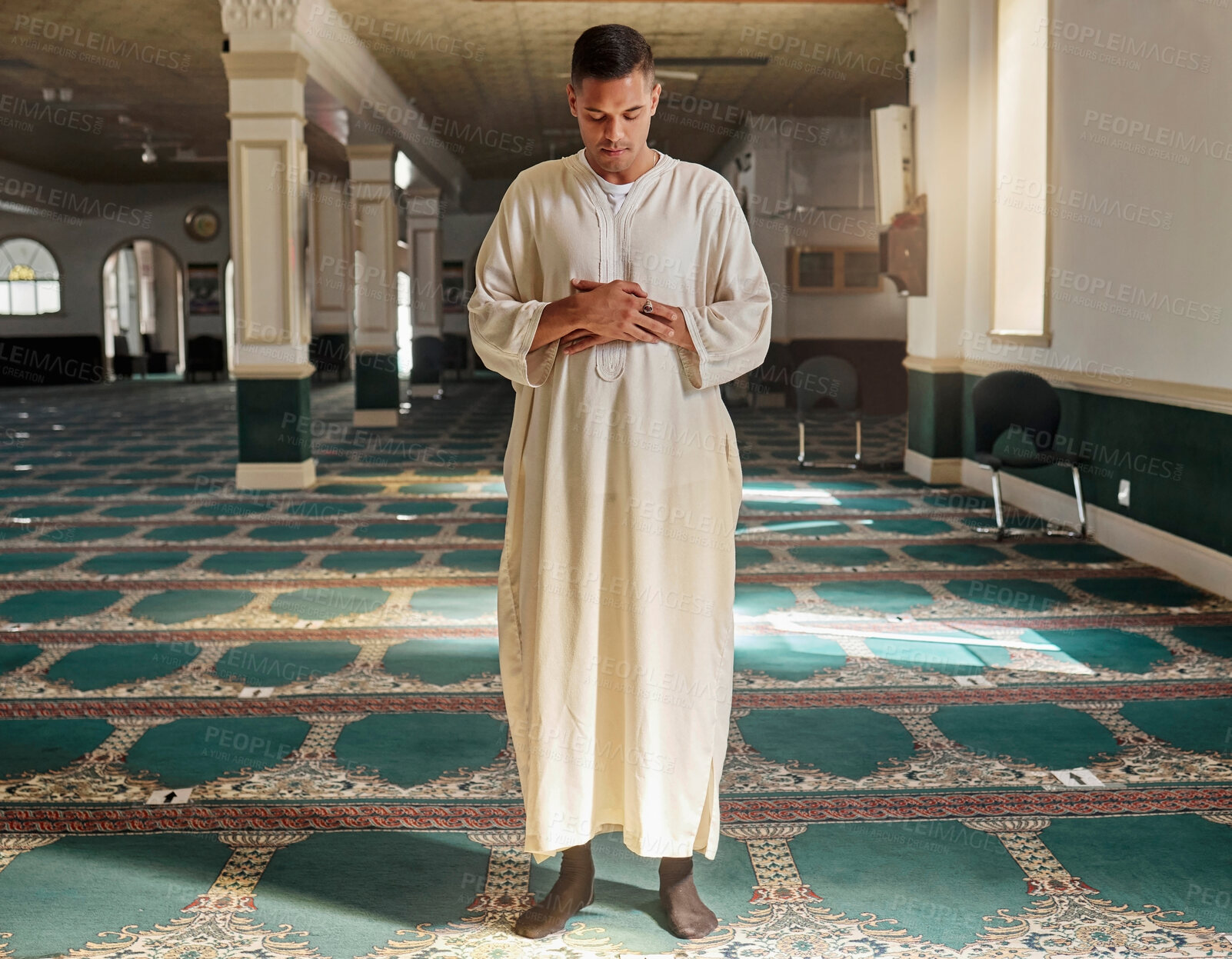 Buy stock photo Man, muslim faith and praying in mosque for God, peace and mindfulness with traditional islamic clothes. Islam worship, prayer and spiritual balance for ramadan, religion and gratitude in Doha, Qatar
