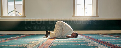 Buy stock photo Mosque, worship and muslim man in prayer on his knees for gratitude, support or ramadan for spiritual wellness. Religion, tradition and islamic guy praying or reciting quran to allah at islam temple.