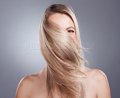 Buy stock photo Woman portrait, blonde or windy hairstyle on studio background for keratin treatment, healthcare wellness or self care grooming. Skincare beauty model, hair care or dye color for argan salon product