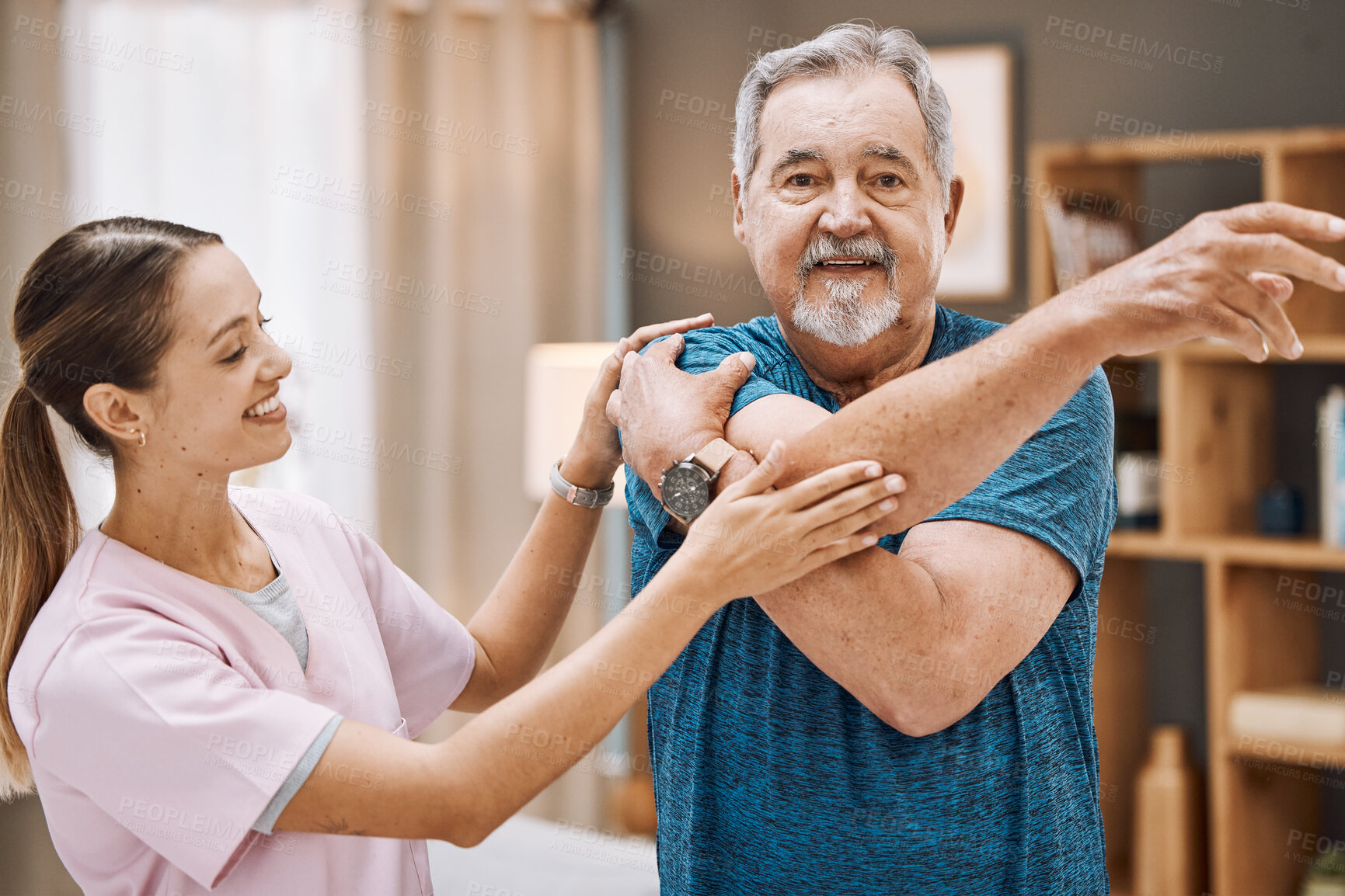Buy stock photo Senior man, nurse and physiotherapy in home visit for healthcare, recovery and healing. Stretching, physical therapy and female medical caregiver helping old male with rehabilitation of arm in house.