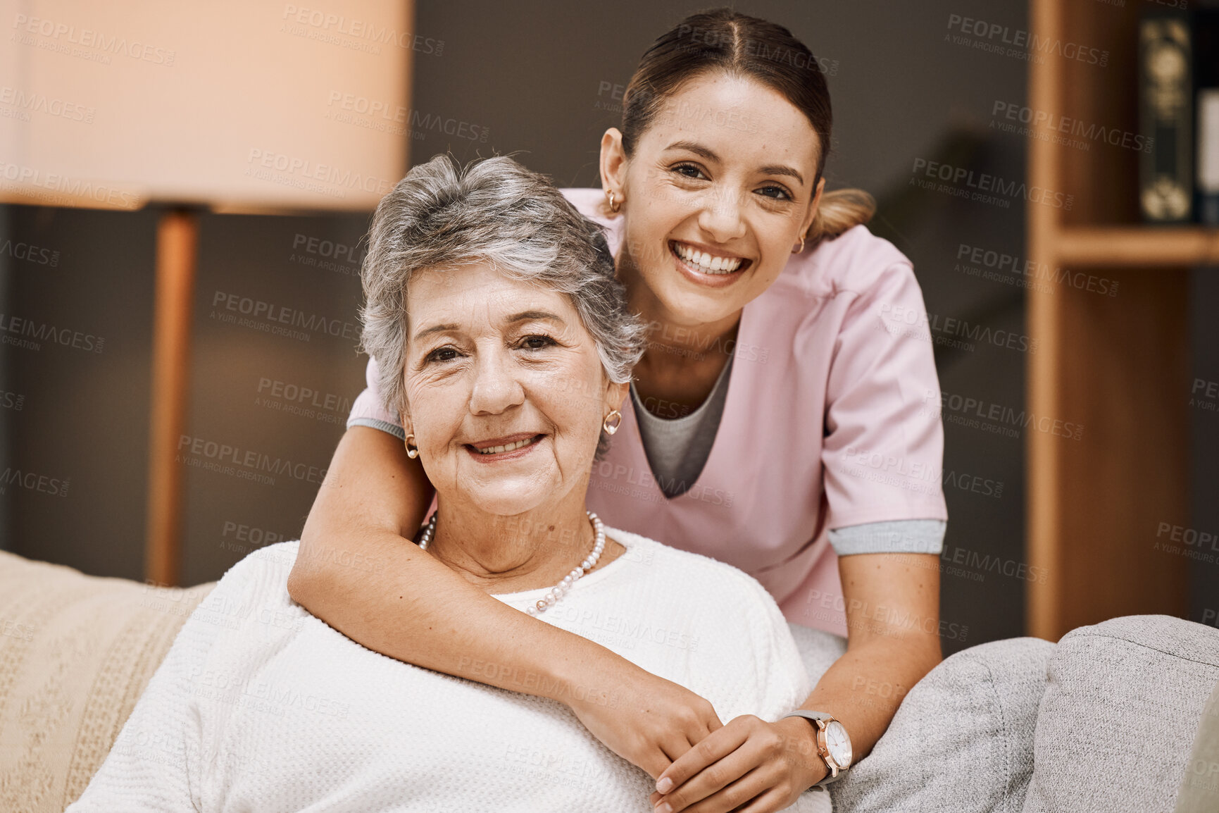 Buy stock photo Support, portrait and nurse with a senior woman on a sofa in the living room of a nursing home. Healthcare, wellness and caregiver embracing an elderly female pensioner at retirement house or clinic.