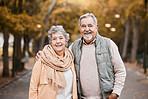 Portrait, love and senior couple in nature, bonding and retirement together. Romantic, mature man and elderly woman walking, loving and peace for marriage, forest and fresh air outdoor, smile and hug