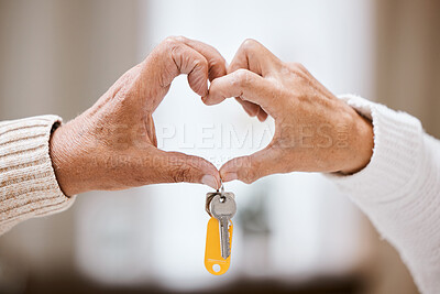 Buy stock photo Senior couple, heart hands and keys for new home, success and bonding with love, care and support. Closeup, elderly people and hand sign together in house, apartment or home with excited homeowner