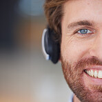 Call center man, closeup and smile in portrait for customer service, happy and focus with headphones. Customer support, crm expert and happiness in zoom of face, eye and telemarketing job in Orlando