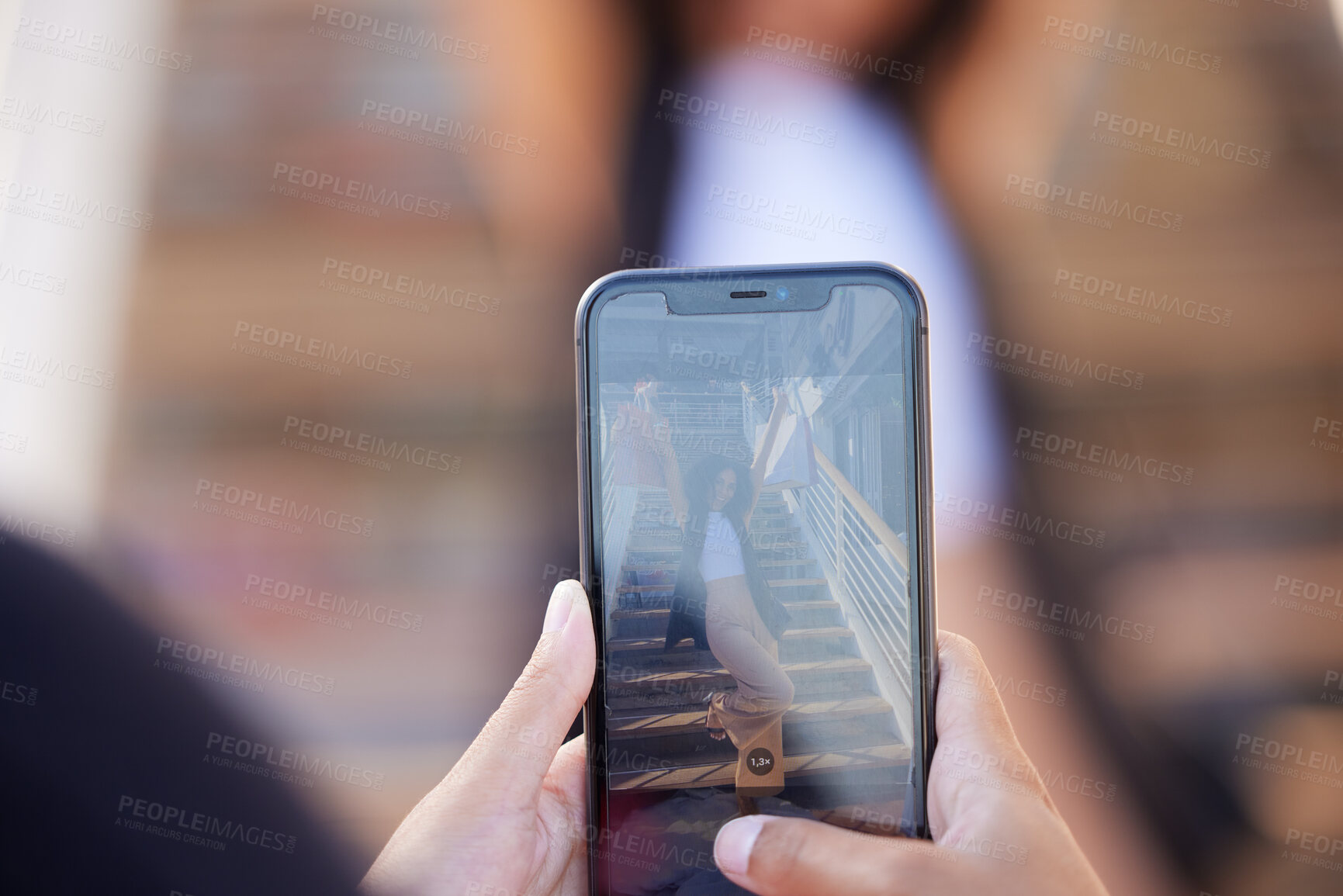 Buy stock photo Hands, phone and picture of woman with shopping bags shopping in the city. Discount deals, sales or pov of friend taking photo of female by stairs at mall with mobile smartphone for social media post