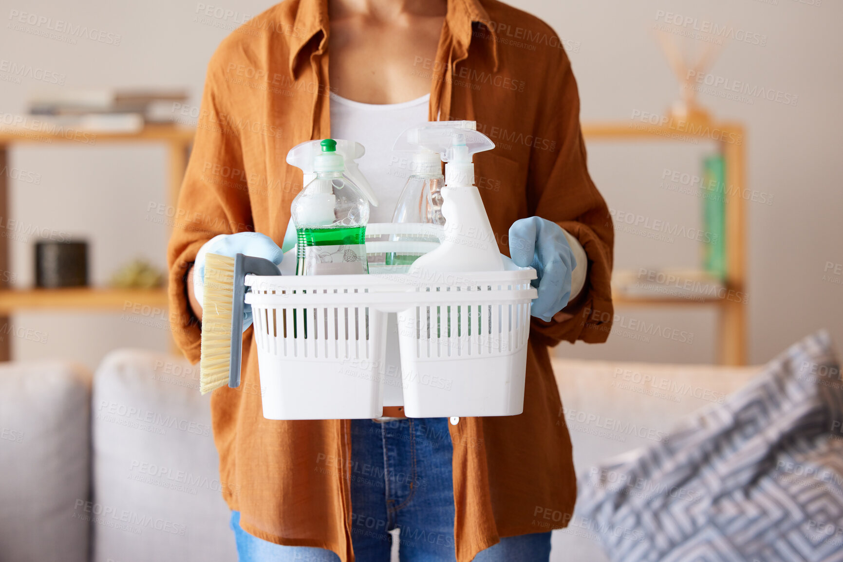 Buy stock photo Cleaning, hygiene and detergent with a woman holding a basket of products as a cleaner in a home. Bacteria, container and spray bottle with a female housekeeper ready to clean with disinfectant