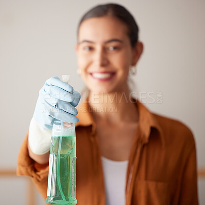 Buy stock photo Woman, spray bottle and cleaning service with a smile in a house or apartment for safety with gloves and chemical. Female cleaner showing liquid product to clean dirt, dust and bacteria at home