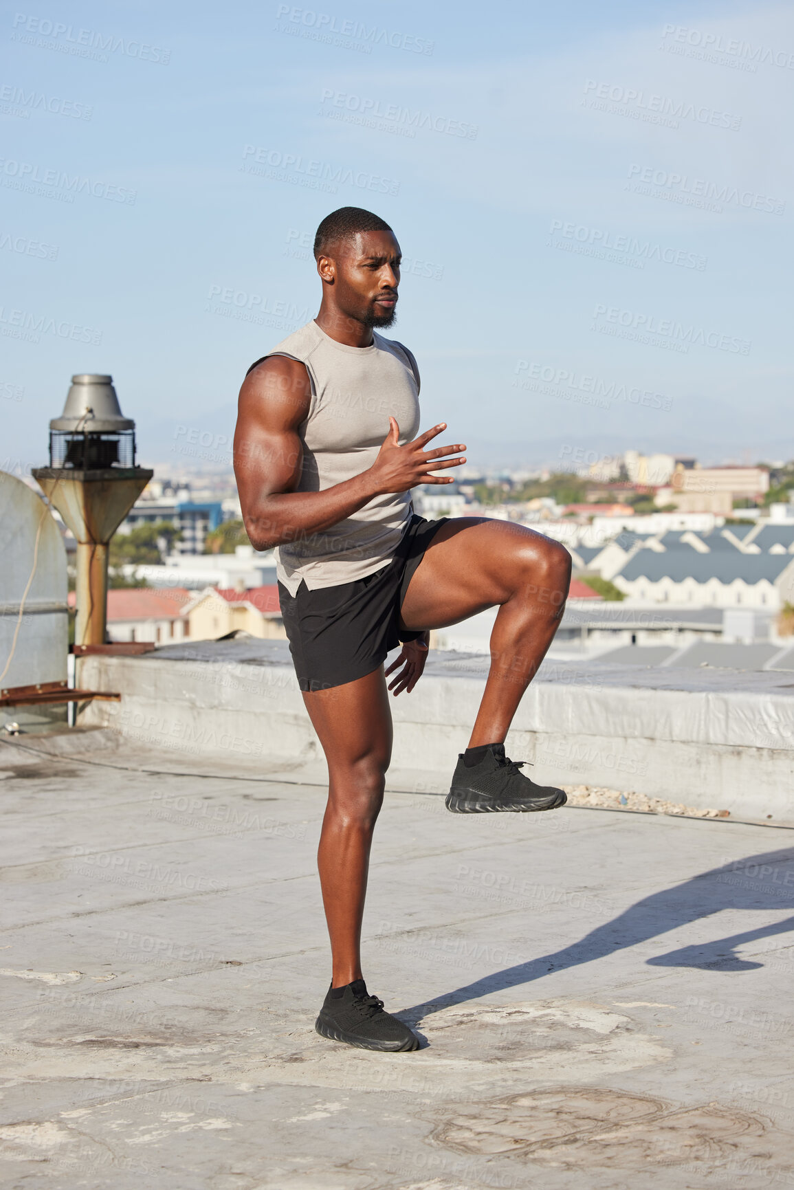 Buy stock photo Health, fitness and black man stretching legs outdoors on city rooftop alone. Sports, training and male athlete warm up, preparing and getting ready for workout, running or exercise for wellness.