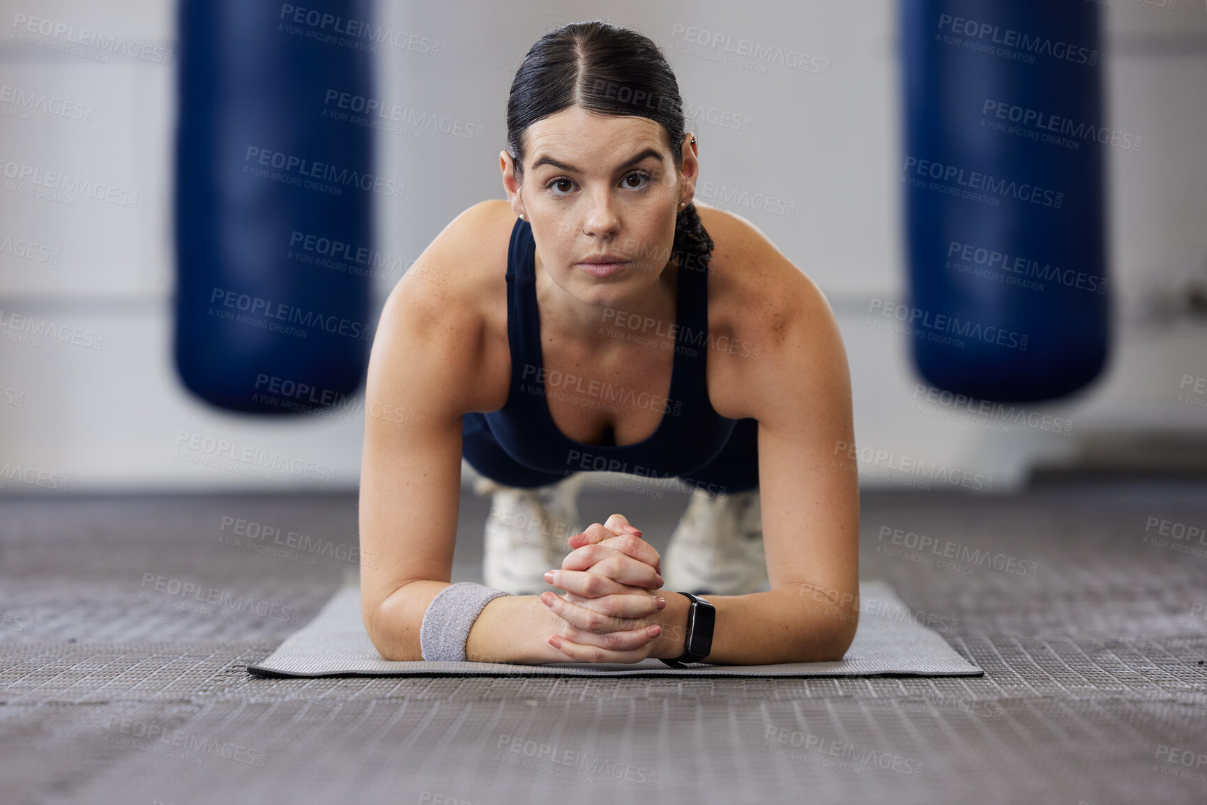 Buy stock photo Fitness, woman and plank exercise in gym for wellness training, healthy lifestyle and workout. Portrait, focus and strong female athlete on elbow, floor and push up for sports, body muscle and power