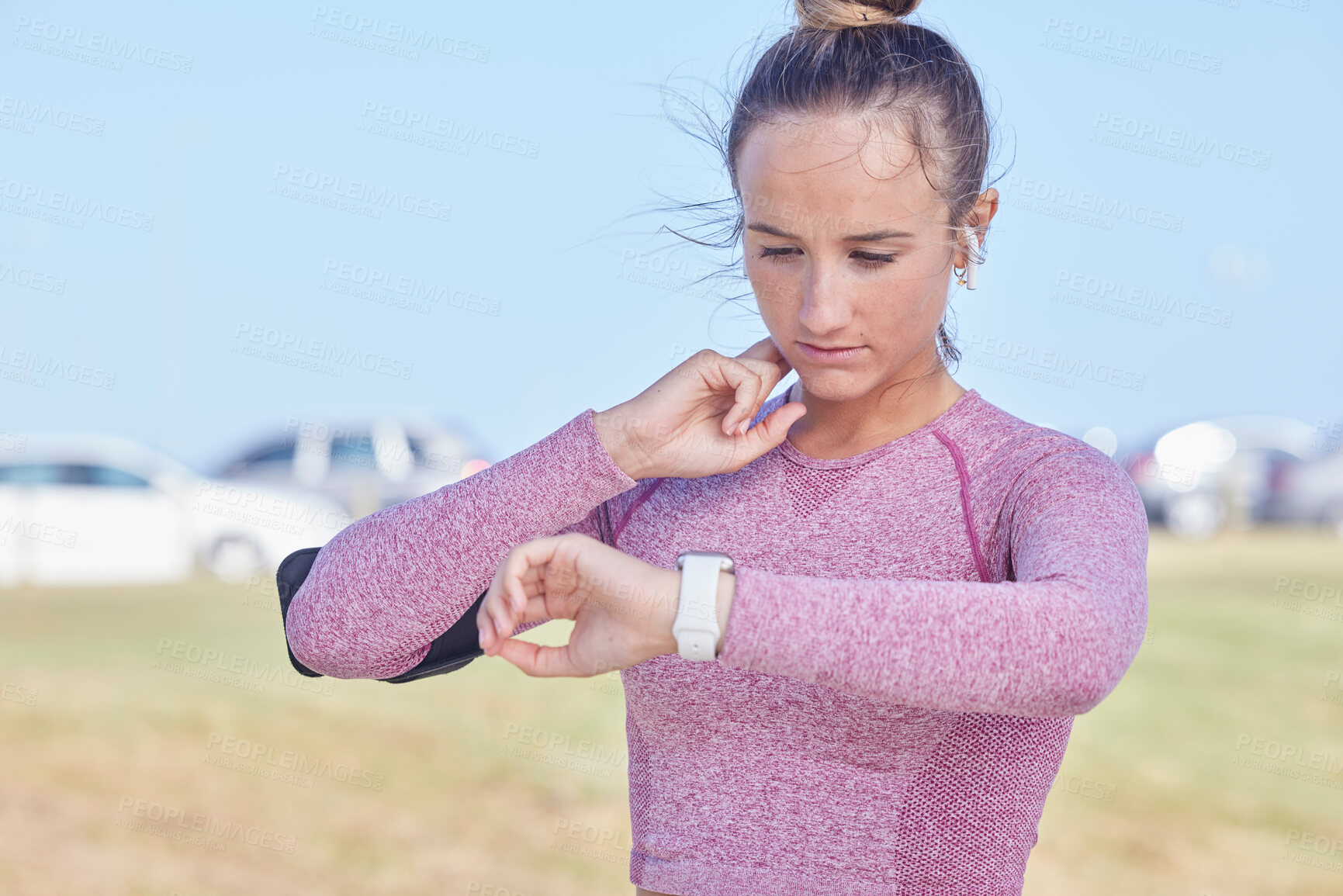 Buy stock photo Exercise, woman and smartwatch for pulse check, training and fitness outdoor for wellness. Female athlete, girl or watch for tracking heart rate, workout or healthcare for body care, sports or cardio