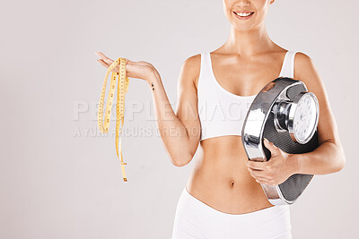Buy stock photo Woman, fitness and scale with measure tape, weight loss and happy for success, achievement and health goal. Model, body and healthy anatomy with smile, wellness and self care by studio background