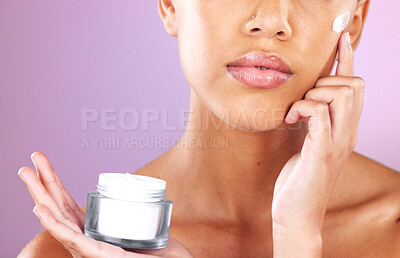 Buy stock photo Skincare, beauty and woman with face cream product for dermatology, health and wellness mock up on a purple background. Aesthetic model in studio for self love, self care and facial spa therapy