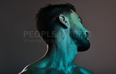 Buy stock photo Skincare, beauty and man with neon lights in studio for cosmetics, grooming and self care treatment. Creative art, design and blue lighting on male fashion model for satisfaction, wellness and style
