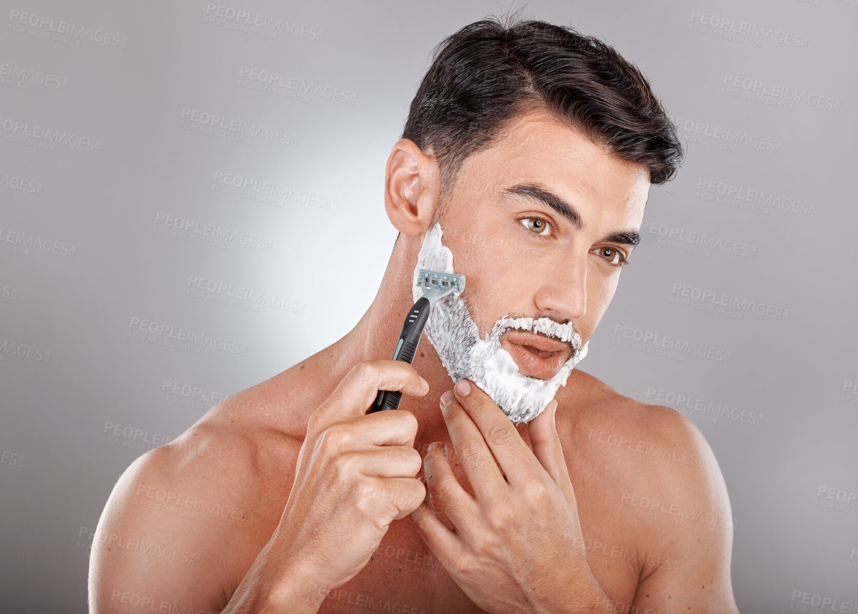 Buy stock photo Grooming, foam and shaving with face of man with razor for beauty, hygiene and skincare with morning routine. Self care, facial and shave beard with model and cream product for wellness and cleaning