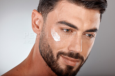 Buy stock photo Man, face and cream for skincare and beauty closeup with sunscreen, facial treatment and moisturizer cosmetics. Lotion, healthy skin with wellness and glow, cosmetic care against studio background