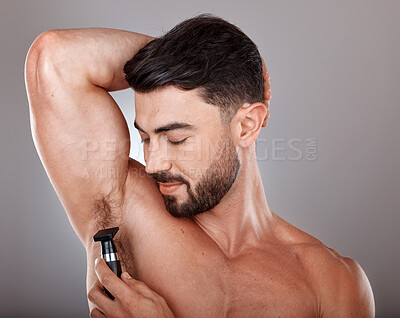 Buy stock photo Man, razor and armpit hair for skincare wellness, hygiene grooming and natural self care cosmetics treatment in grey studio background. Model, shaving and dermatology cleaning or hair removal routine