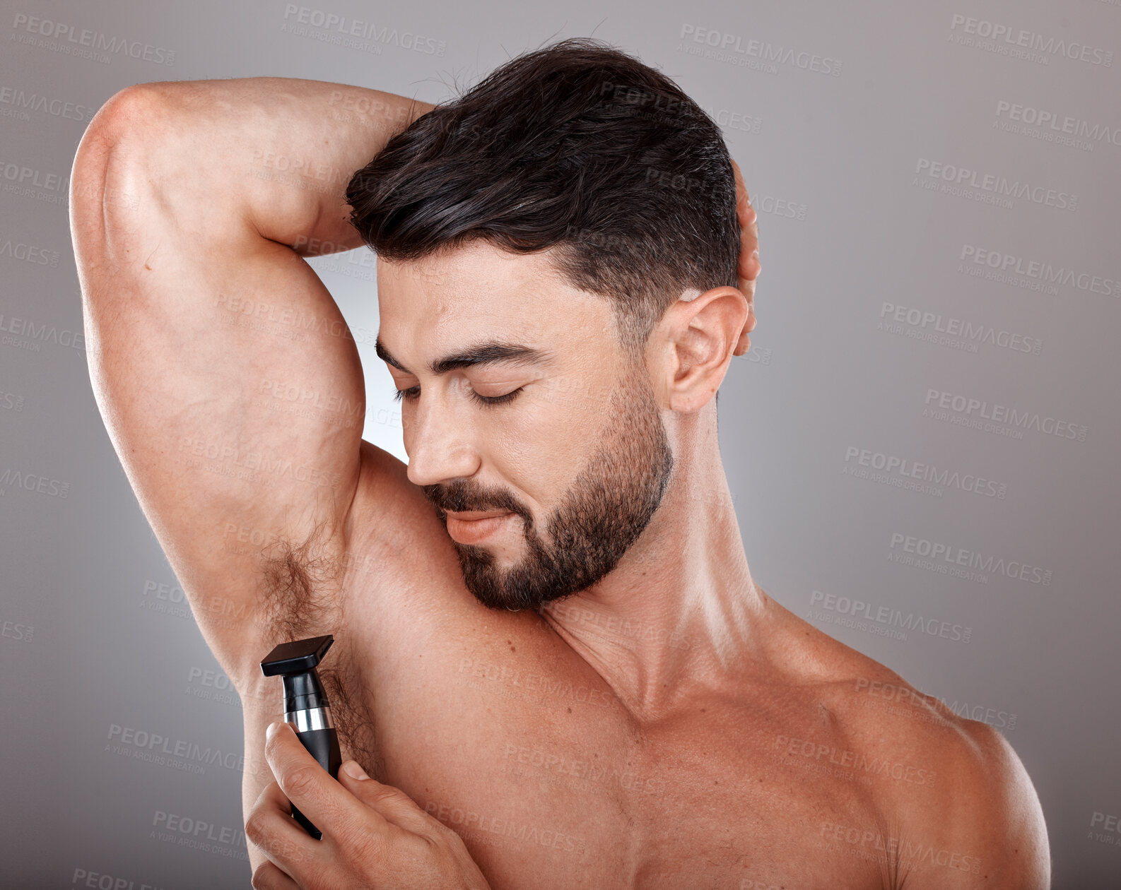 Buy stock photo Man, razor and armpit hair for skincare wellness, hygiene grooming and natural self care cosmetics treatment in grey studio background. Model, shaving and dermatology cleaning or hair removal routine