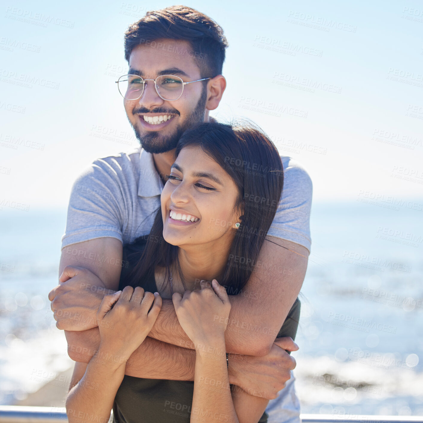 Buy stock photo Love, ocean and happy couple hug, relax and enjoy outdoor quality time together for peace, freedom and romantic date. Beach, sea and man and woman bond on fun travel holiday in Rio de Janeiro Brazil