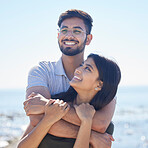 Smile, hug and support with couple at beach, travel and care on summer holiday by ocean, commitment and love outdoor. Young, happy and relationship with romantic date, man and woman embrace on trip